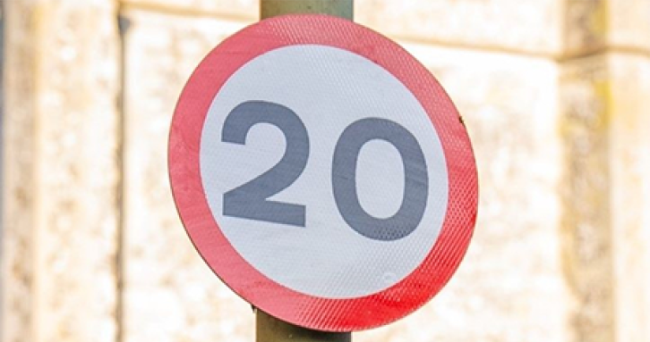 Red and white circular transport sign, with 20mph in centre.