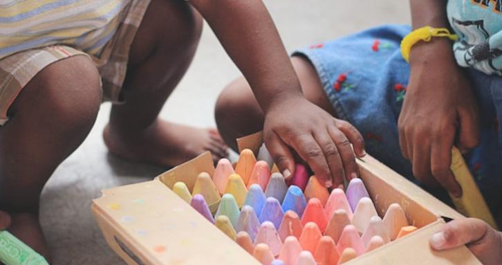 Children playing with chalks