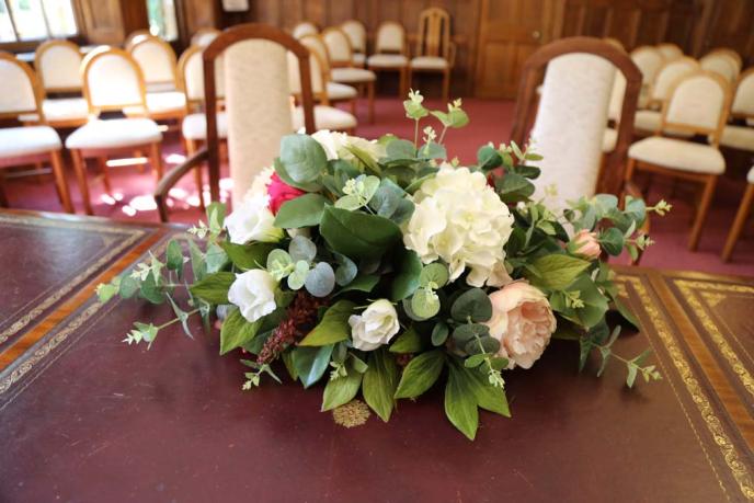 Close up of flowers on the Banbury Ceremony Room table.