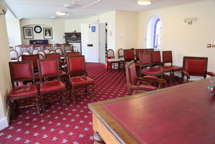 bicester ceremony room from the front with 20 empty chairs facing forward.